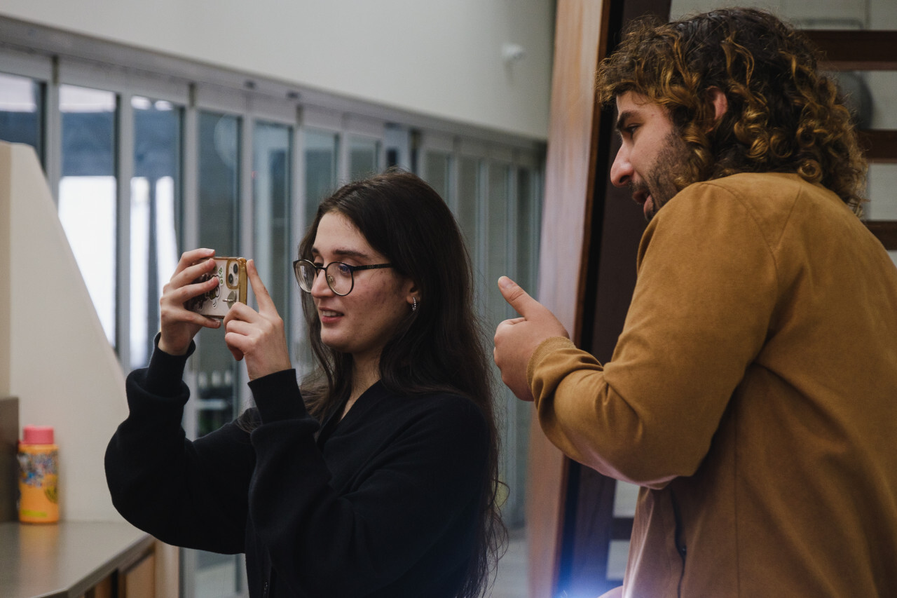 Girl with phone camera learning